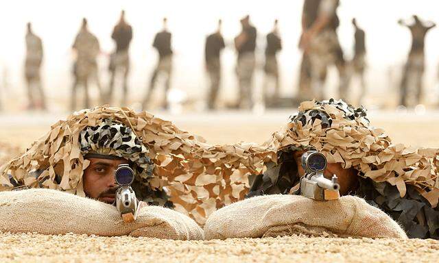 Members of Saudi special forces aim their guns during a training session in Darma, west of Riyadh