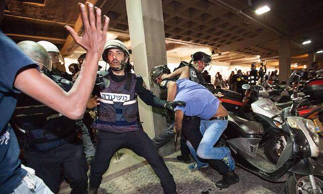 May 3 2015 Tel Aviv Israel Riot police detain a demonstrator during a demonstration of Ethiop