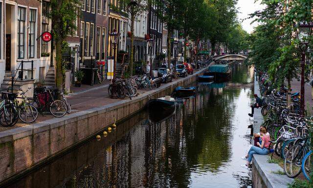 Tourism In Amsterdam View of the concentric canals of Amsterdam, Netherlands, on August 19, 2021. They are a set of cana