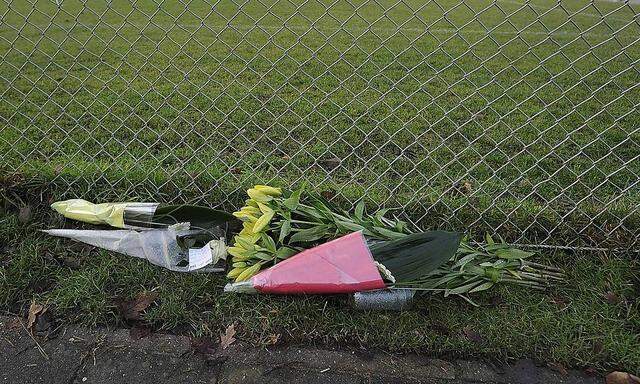 Flowers lay on the pitch of the soccer club Buitenboys, in Almere