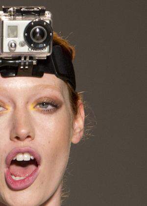 Stafford-Abbott wears a GoPro camera during rehearsals for the Lela Rose Spring/Summer 2013 collection at New York Fashion Week