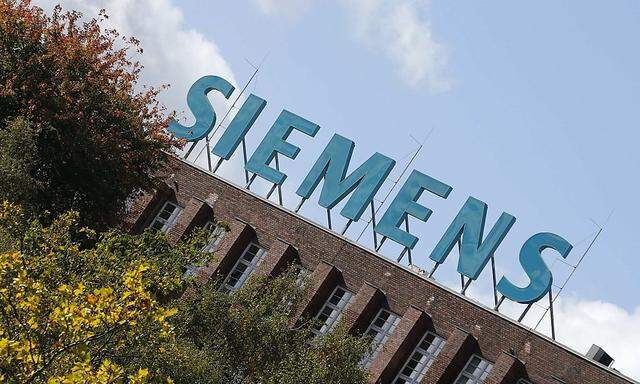 File photo of the logo of Siemens AG company on top of a factory in Berlin