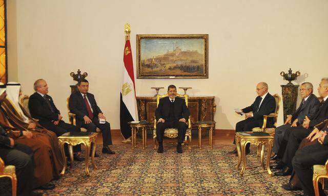 Handout photo of Egypt's President Mursi meeting with members of the OAPEC in Cairo