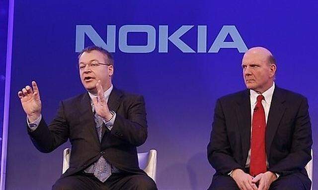 Stephen Elop CEO of Nokia, left, with CEO of Microsoft Steve Ballmer, speaking in London, as he annou