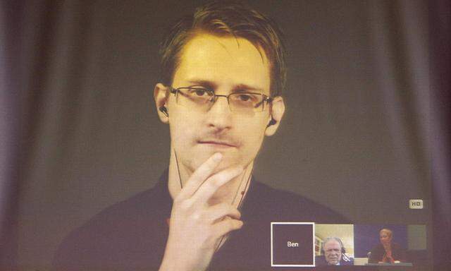 Former US National Security Agency contractor Edward Snowden appears live via video during a meeting about whistle blowers at the Council of Europe in Strasbourg