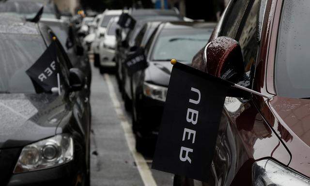Uber drivers´ cars are seen parked during a protest outside the Ministry of Transportation building in Taipei
