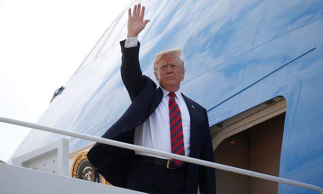 U.S. President Donald Trump boards Air Force One to depart for travel to Canada from Joint Base Andrews in Maryland, U.S.