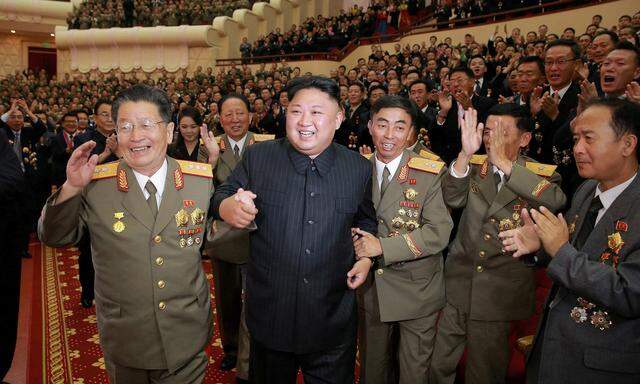 North Korean leader Kim Jong Un reacts during a celebration for nuclear scientists and engineers who contributed to a hydrogen bomb test, in this undated photo released by North Korea´s Korean Central News Agency (KCNA)