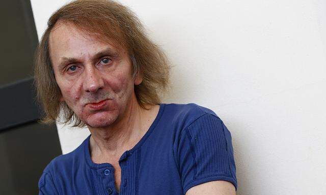 Michel Houellebecq poses during the photo call for the movie ´Near Death Experience´ at the 71st Venice Film Festival