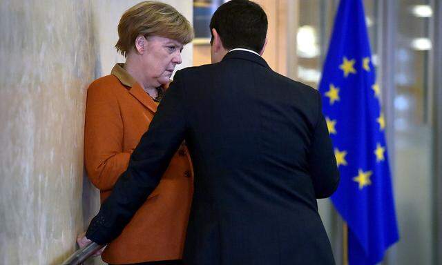 Greece's PM Tsipras chats with Germany's Chancellor Merkel prior to a meeting over the Balkan refugee crisis with leaders from central and eastern Europe in Brussels