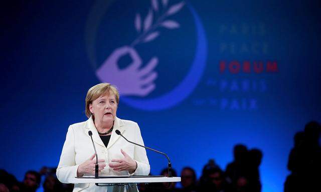 German Chancellor Angela Merkel delivers a speech at the opening session of the Paris Peace Forum