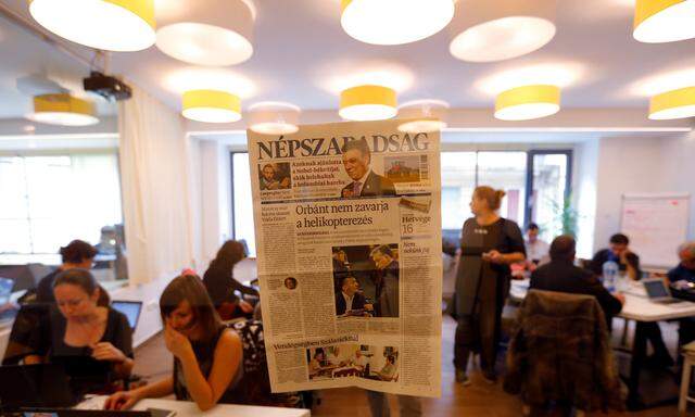 A copy of the last issue of the leftist newspaper Nepszabadsag, which was unexpectedly shut down on Saturday amid cries of a crackdown by right-wing Prime Minister Viktor Orban´s government, hangs on the wall of a temporary newsroom in Budapest