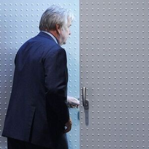 Austrian construction group Strabag CEO Haselsteiner leaves briefly during news conference in Vienna