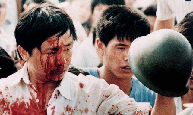 File photo of a blood-covered protester after violent clashes with Chinese military forces in Beijing's Tiananmen Square
