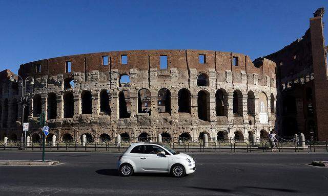 FILE PHOTO: A Fiat 500 is seen in front of the ancient Colosseum in Rome