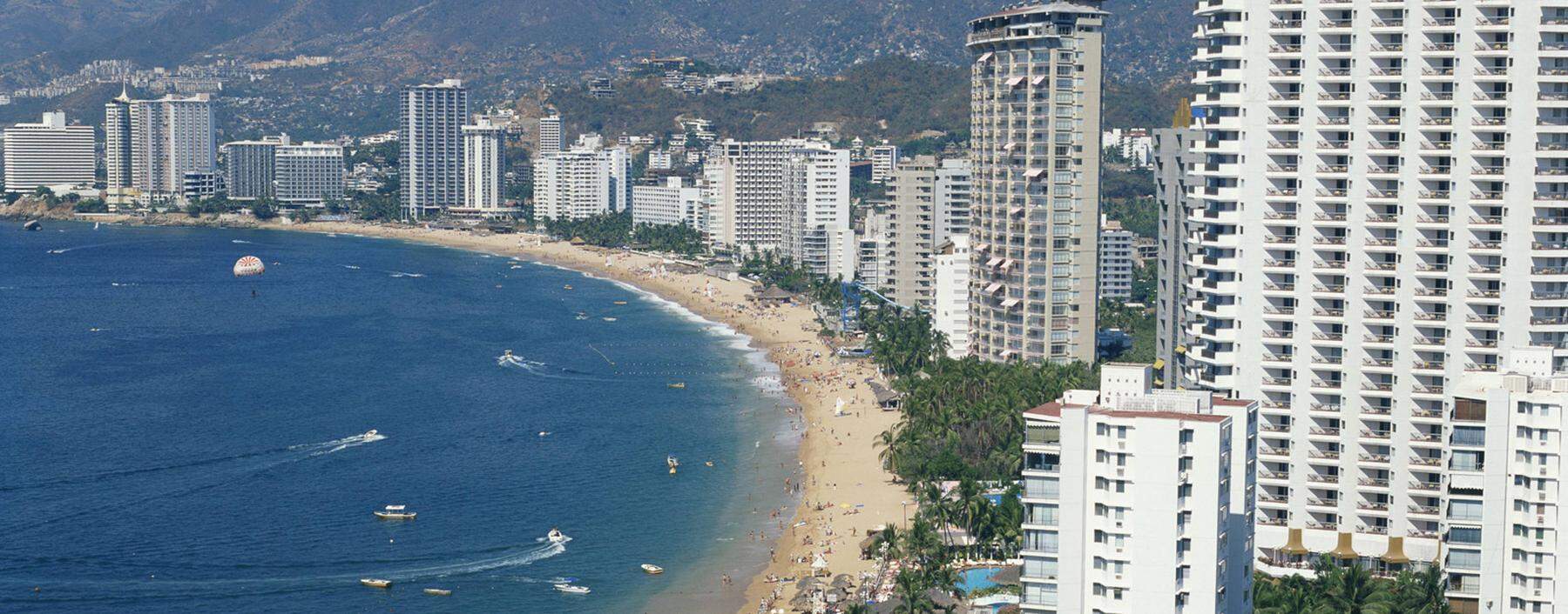 The beach and high rise buildings at the resort of Acapulco Mexico North America PUBLICATIONxINxGE