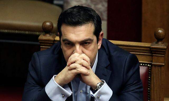 Greek PM Tsipras attends a parliamentary session before a budget vote in Athens