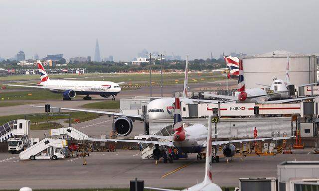 FILE PHOTO: British Airways planes at Heathrow Terminal 5