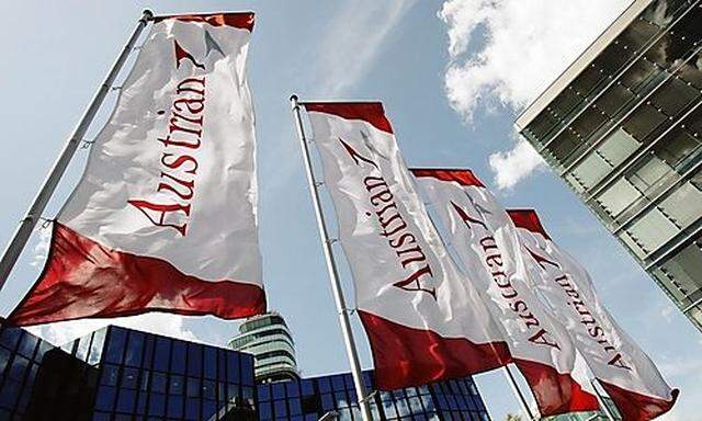 Austrian Airlines AUA flags flie in front of AUA's headquarters during a works council meeting at the