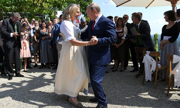 Austria's Foreign Minister Kneissl dances with Russia's President Putin at her wedding in Gamlitz