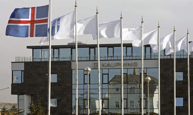 The Iceland flag flies next to the headquarters of Kaupthing Bank in Reykjavik