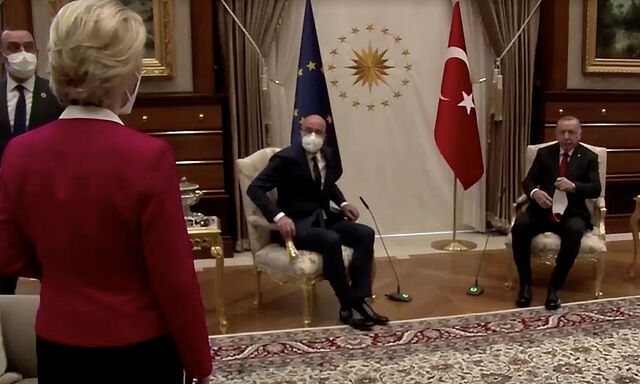 European Commission President Ursula von der Leyen stands as European Council President Michel and Turkish President Erdogan take seats in Ankara