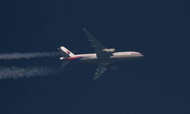 File photo of Malaysia Airlines Boeing 777 plane with registration number 9M-MRO flying over Poland