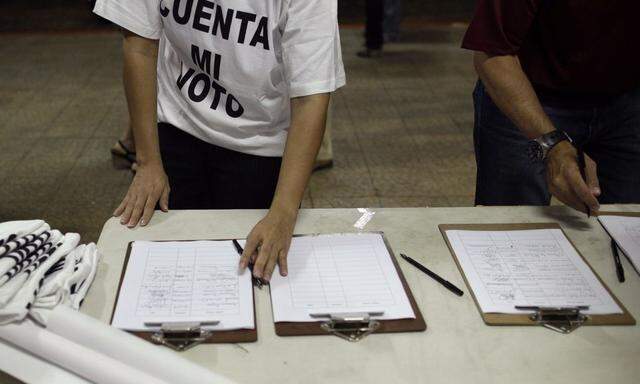 A Venezuelan supporter of Venezuelan opposition leader Henrique Capriles wears a t-shirt that reads 'Count my Vote' during a gathering for a petition in Panama City