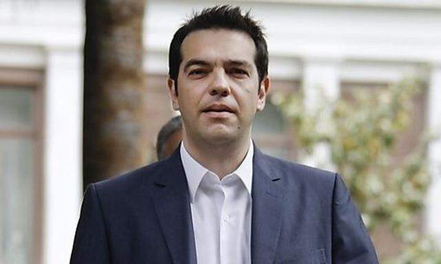 Leader of the Left Coalition party Alexis Tsipras leaves the Presidential palace after taking a manda
