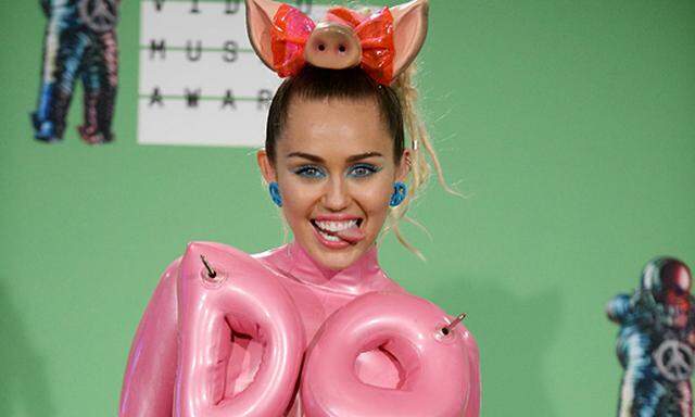 Host Miley Cyrus appears backstage following the 32nd annual MTV Video Music Awards at Microsoft The