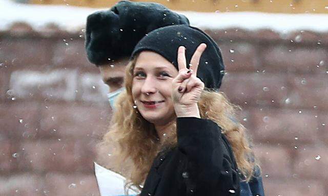 MOSCOW, RUSSIA - MARCH 18, 2021: Maria Alyokhina (R), a member of the Russian punk rock group Pussy Riot, makes a V-sign