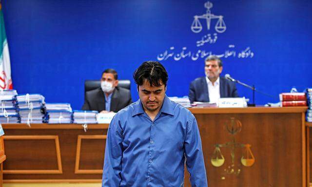 Ruhollah Zam, a dissident journalist who was captured in what Tehran calls an intelligence operation, is seen during his trial in Tehran