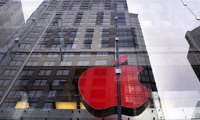 Apple logo on display at the Sydney Apple Store is illuminated in red to mark World AIDS Day in Sydney