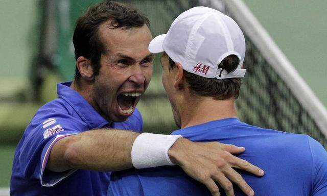Czech Stepanek celebrates with his team mate Berdych after defeating Argentina's Zeballos and Berlocq during their Davis Cup semi-final doubles match in Prague