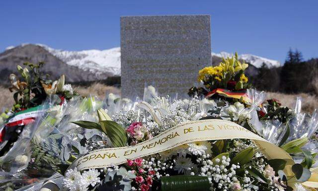 Flowers are seen at the memorial for the victims of the air disaster in the village of Le Vernet, near the crash site of the Germanwings Airbus A320 in French Alps