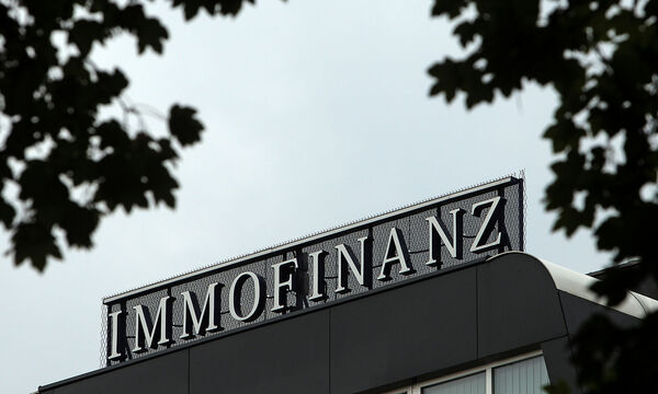 FILE PHOTO: The logo of Austrian real estate group Immofinanz is pictured on top of the company's headquarters building in Vienna