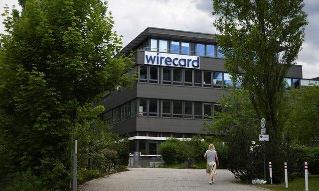FILE PHOTO: A woman enters the headquarters of Wirecard AG in Aschheim