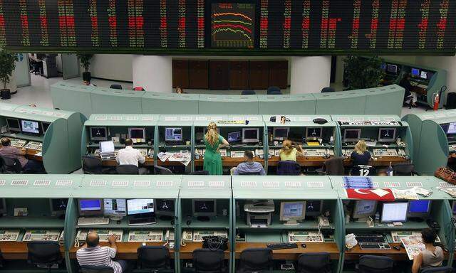 Traders work during the afternoon session at the Istanbul Stock Exchange