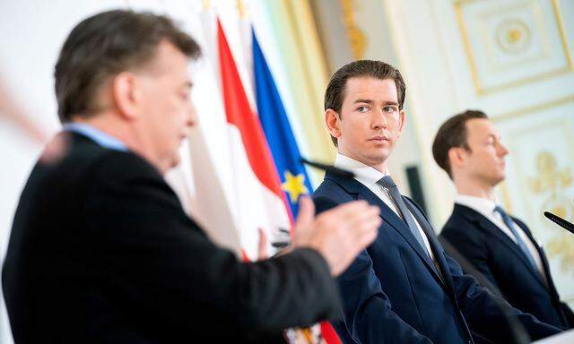 Austrian Chancellor Sebastian Kurz, Vice-Chancellor Werner Kogler and Finance Minister Gernot Bluemel address the media in Vienna