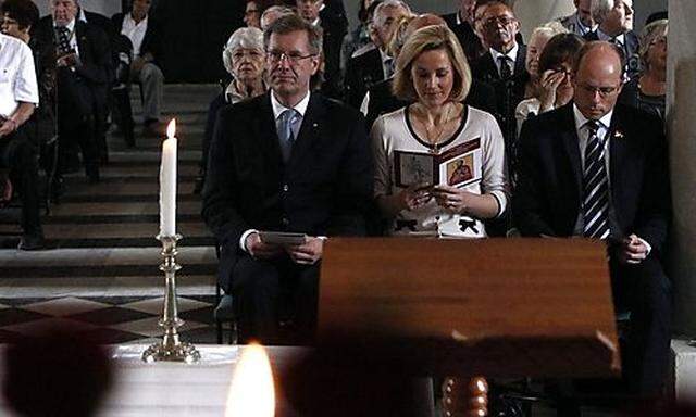 German President Wulff, his wife Bettina and German member of parliament Beyer attend an ecumenical s