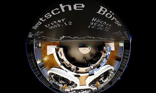FILE PHOTO: The German share prize index board and the trading room of Frankfurt's stock exchange are photographed with a circular fisheye lens during afternoon trading session in Frankfurt