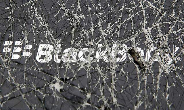 A Blackberry logo is seen through a cracked box in this photo illustration taken in Zenica