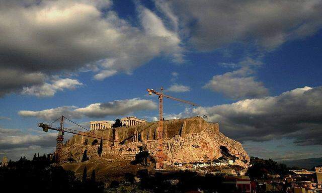 File picture of cranes at foothills of Acropolis during transfer operation of artefacts from Acropolis to new location some 400 meters away in Athens