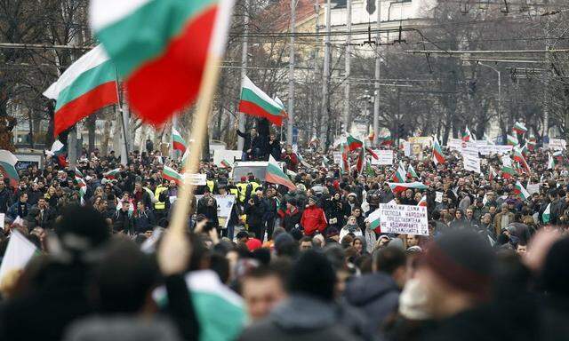 Thousands of demonstrators march on a street during a protest against high utility bills and monopolies in the energy sector in Sofia