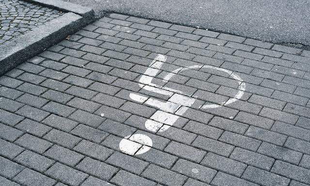 bavaria, germany - march 09. 2021: parking for people with disabilities and wheelchairs in a paved parking lot.