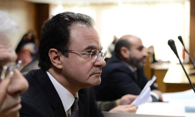 Giorgos Papakonstantinou within his lawyers First day in high court special trial against the former