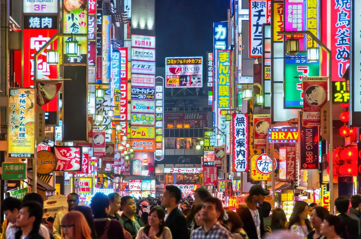 Luminous clams and urban backdrop compress in Tokyo into a symbol of modern energy and way of life.
