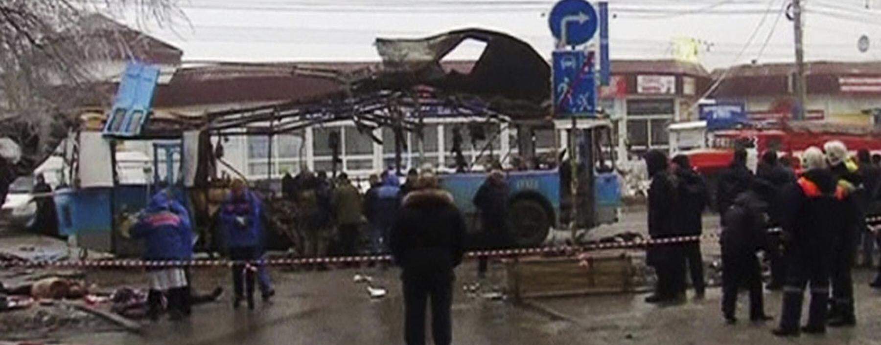 A still image taken from video shows members of the emergency services working at the site of a blast on a trolleybus in Volgograd