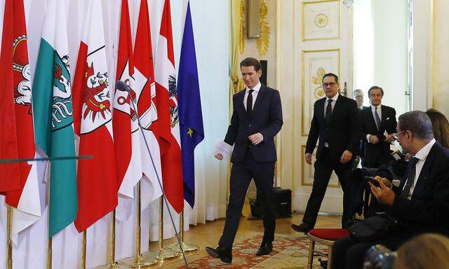 Austrian Chancellor Kurz and Vice Chancelllor Strache arrive for a news conference after a cabinet meeting in Vienna