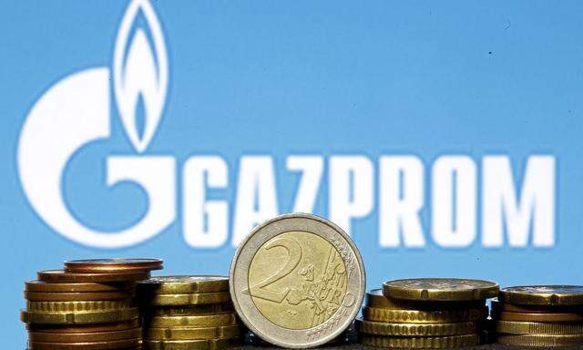Euro coins are seen in front of displayed logo of Gazprom in this picture illustration taken in Zenica